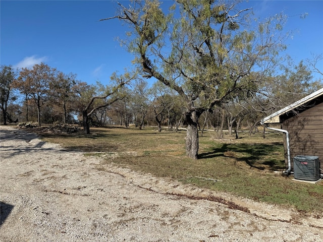 view of yard featuring central AC