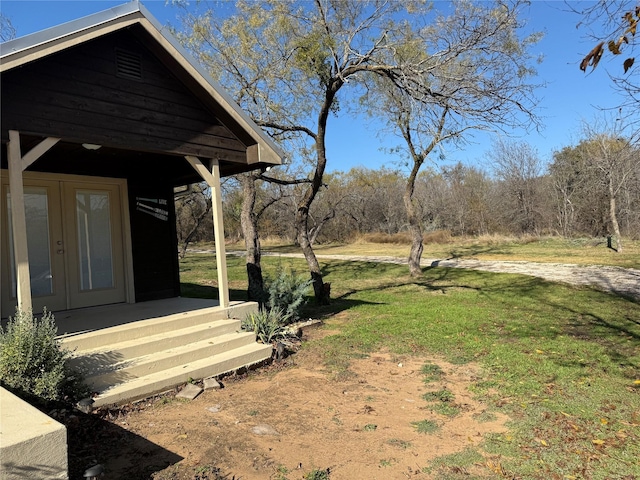 view of yard with french doors