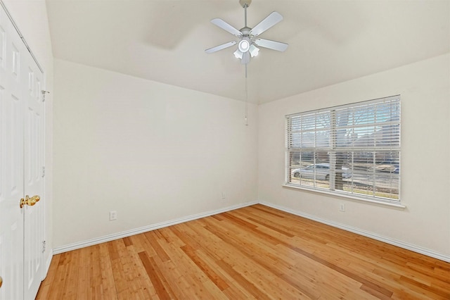 empty room featuring hardwood / wood-style flooring and ceiling fan