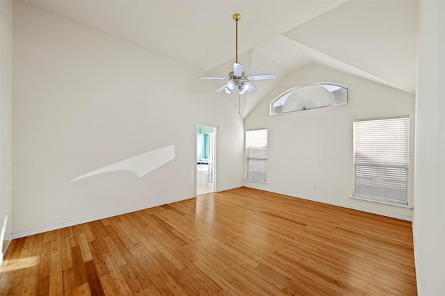 unfurnished living room featuring ceiling fan, hardwood / wood-style floors, and high vaulted ceiling