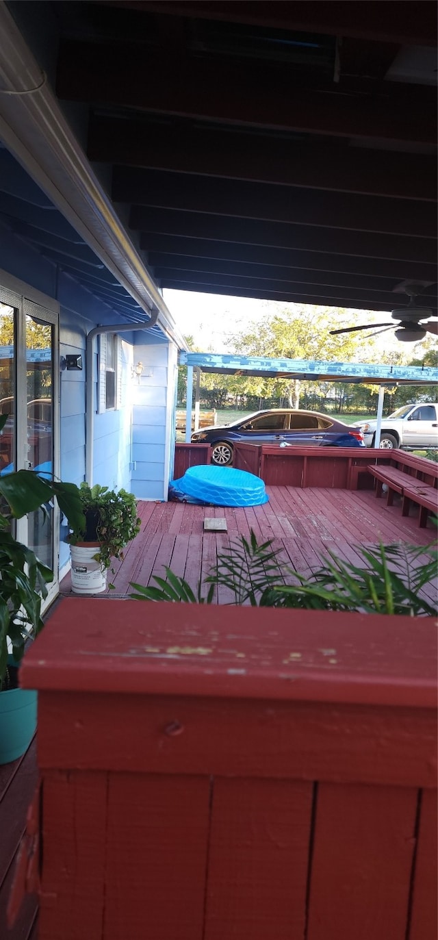 wooden deck featuring a jacuzzi