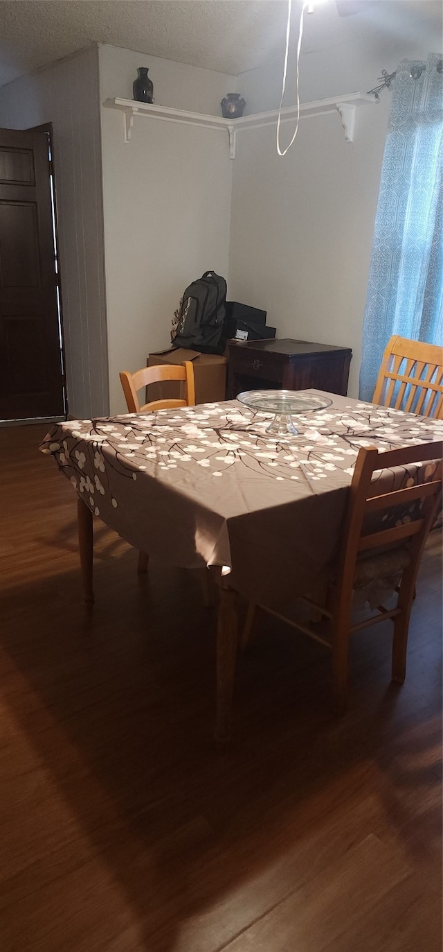 dining space featuring wood-type flooring