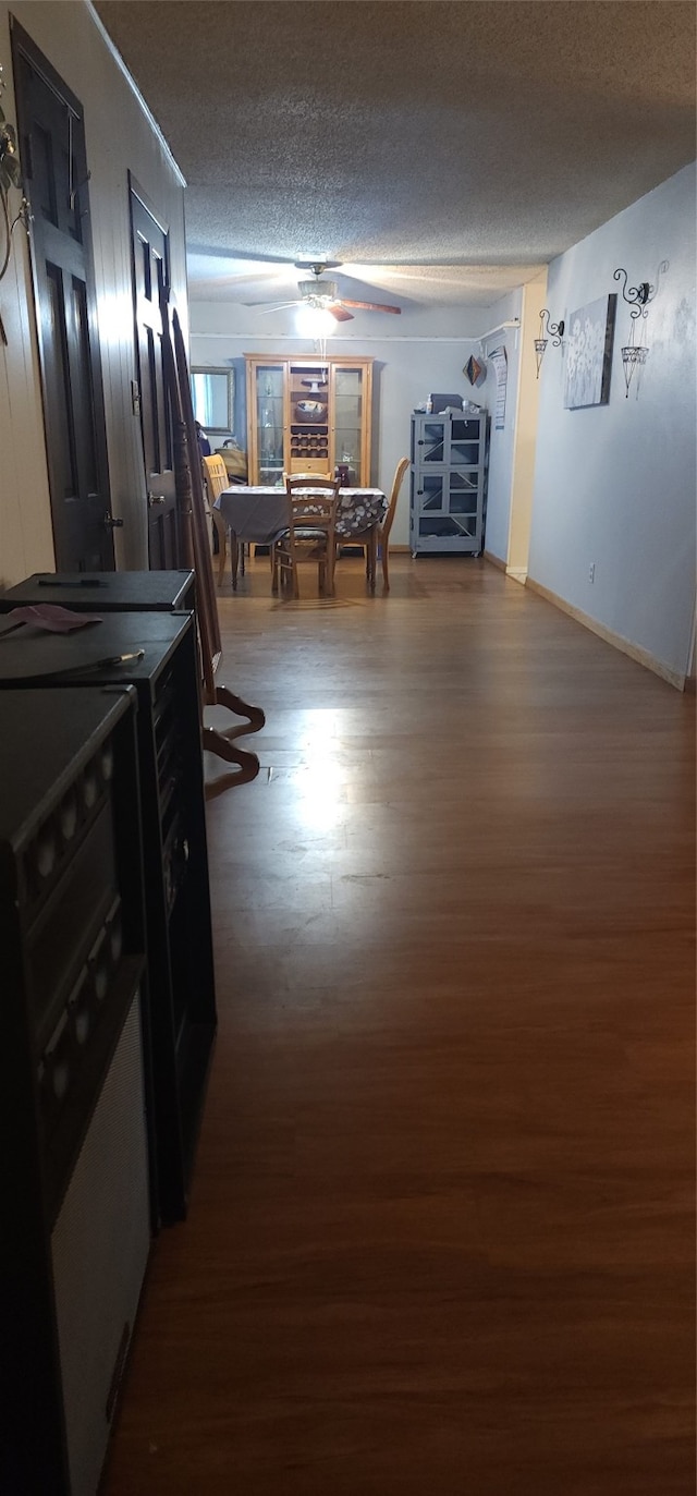 interior space with hardwood / wood-style floors and a textured ceiling