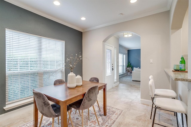 dining space featuring ornamental molding