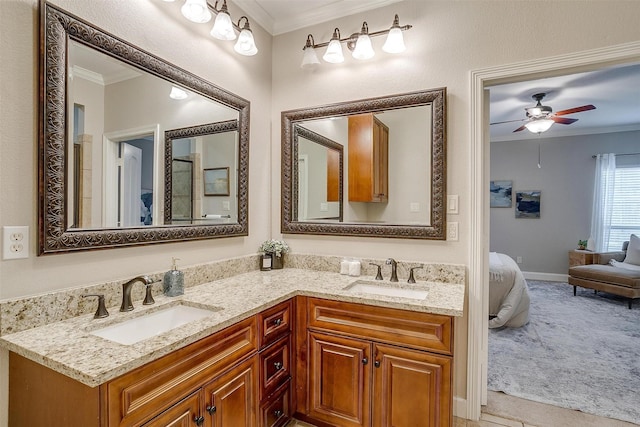 bathroom featuring vanity, crown molding, and ceiling fan