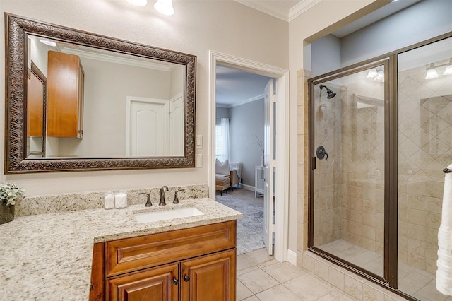 bathroom with vanity, crown molding, and walk in shower