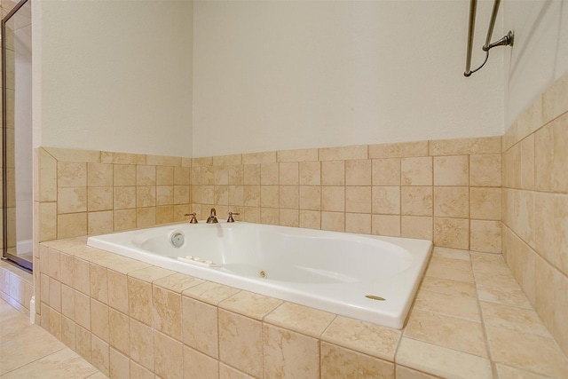 bathroom with tiled bath