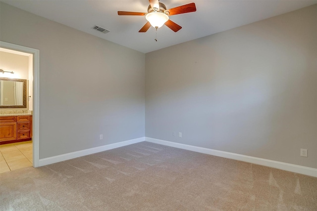 carpeted empty room with ceiling fan