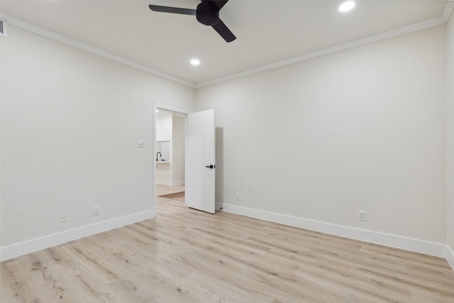 spare room with ceiling fan, light wood-type flooring, and ornamental molding