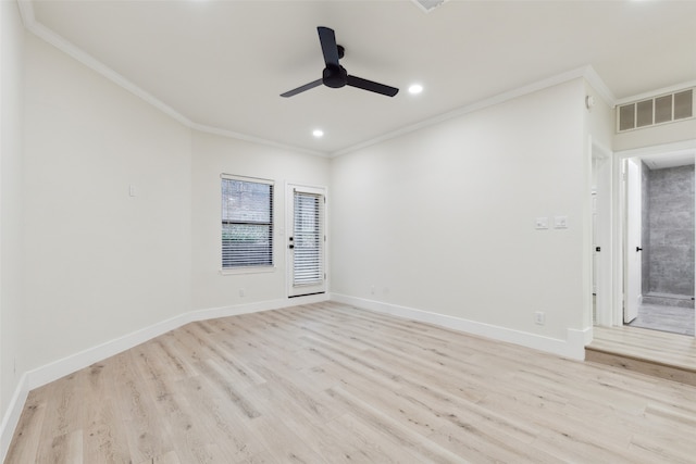 spare room featuring light hardwood / wood-style floors, ceiling fan, and crown molding