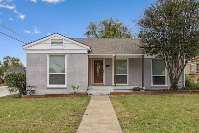 view of front facade with a front lawn and a porch