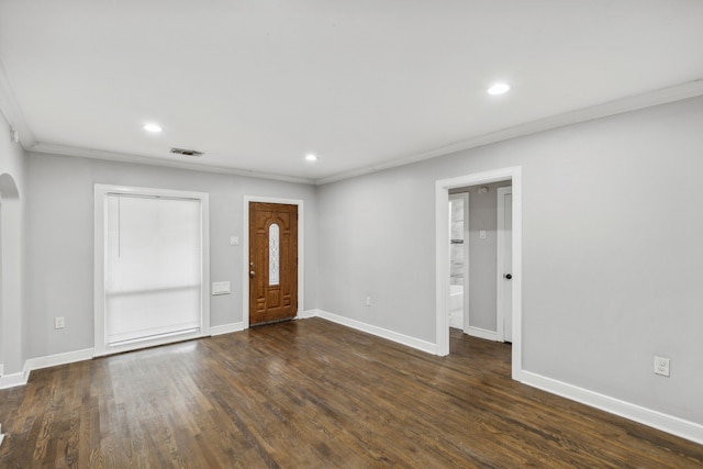 entrance foyer featuring ornamental molding and dark wood-type flooring