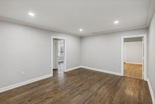 unfurnished room featuring dark hardwood / wood-style floors and crown molding