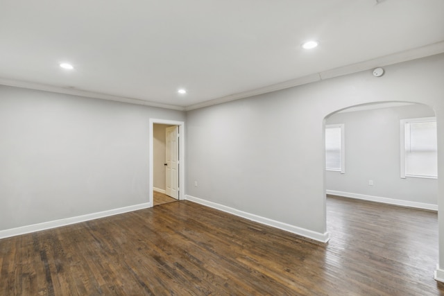 spare room with dark wood-type flooring