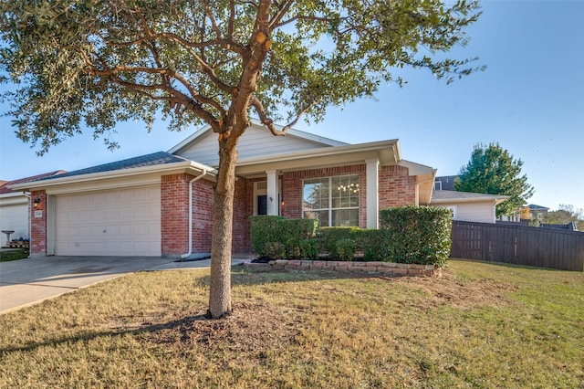 ranch-style home featuring a garage and a front yard