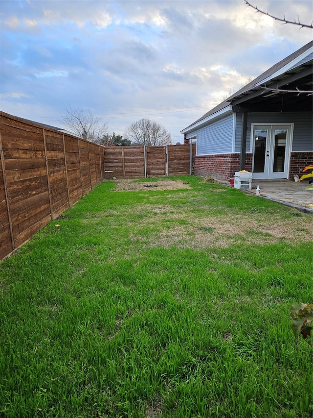 view of yard with french doors