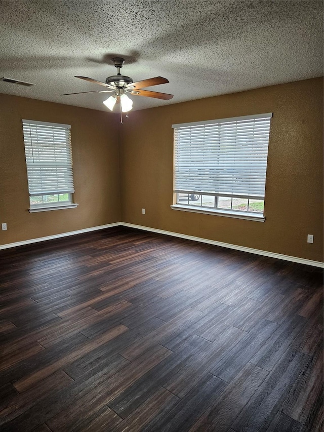 unfurnished room featuring ceiling fan and dark wood-type flooring