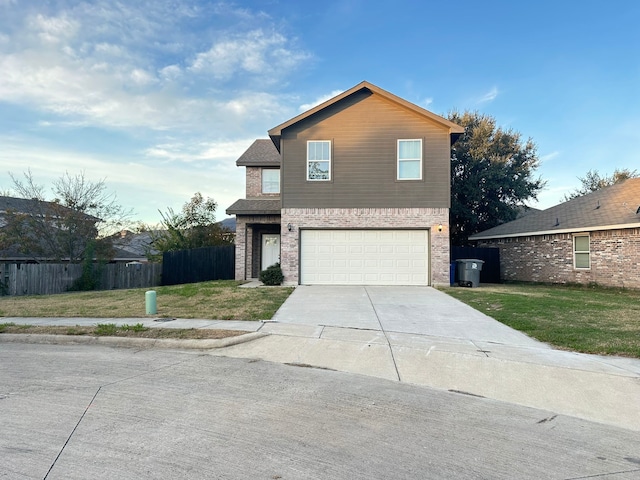 view of front of property with a front yard and a garage