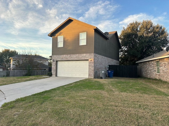 view of home's exterior featuring a garage and a yard