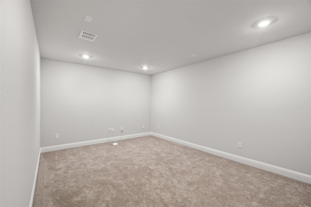 unfurnished room featuring carpet