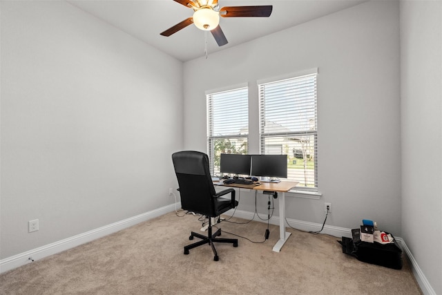 home office featuring light colored carpet and ceiling fan