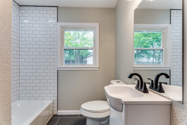 full bathroom with a wealth of natural light, tile patterned flooring, vanity, and toilet