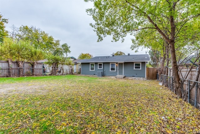 rear view of house with central AC