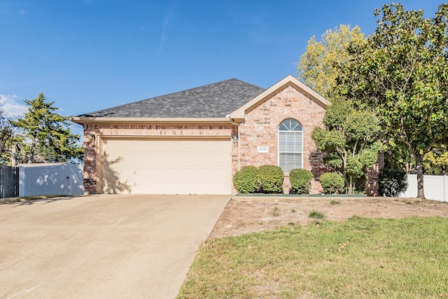 view of front of property featuring a garage