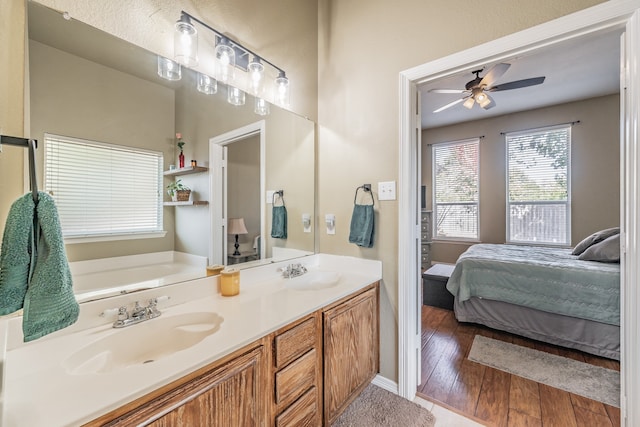 bathroom with vanity, a bathtub, wood-type flooring, and ceiling fan