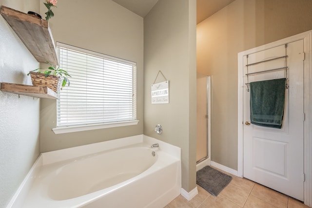 bathroom with tile patterned flooring and plus walk in shower