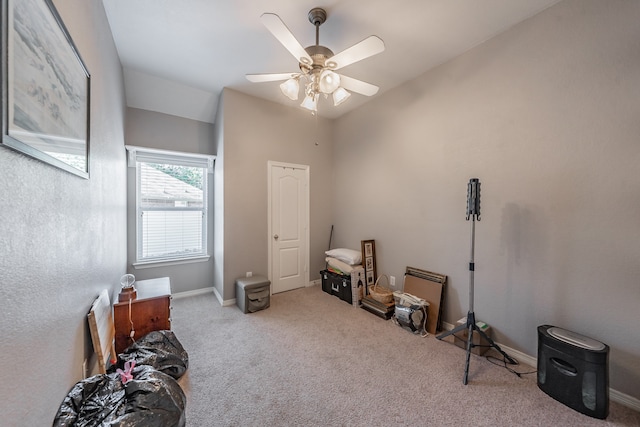 misc room featuring light carpet, lofted ceiling, and ceiling fan