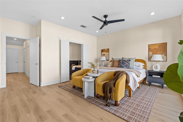 bedroom featuring ceiling fan and light hardwood / wood-style flooring