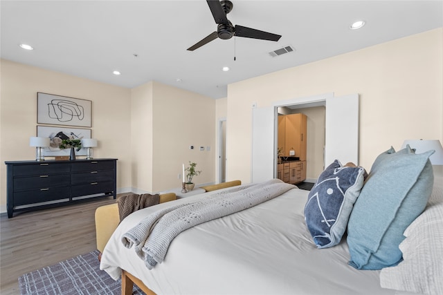 bedroom featuring dark hardwood / wood-style floors and ceiling fan