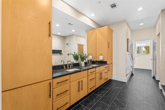 bathroom featuring vanity and walk in shower