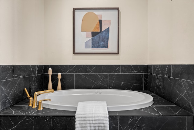 bathroom featuring a relaxing tiled tub