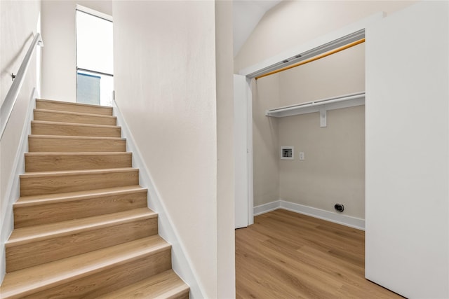 staircase featuring hardwood / wood-style floors