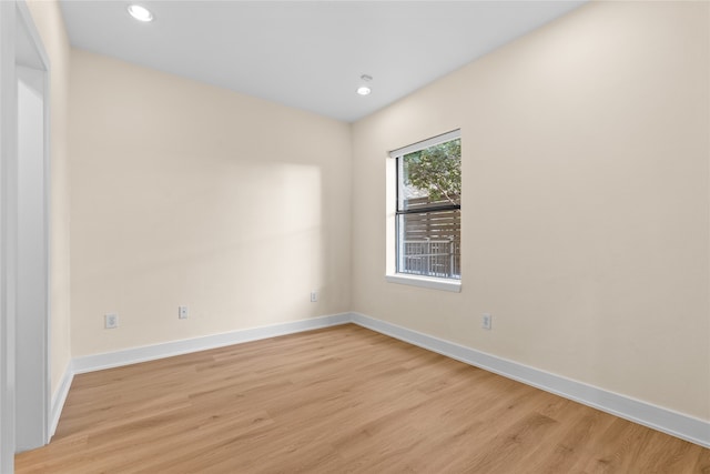 spare room with light hardwood / wood-style flooring