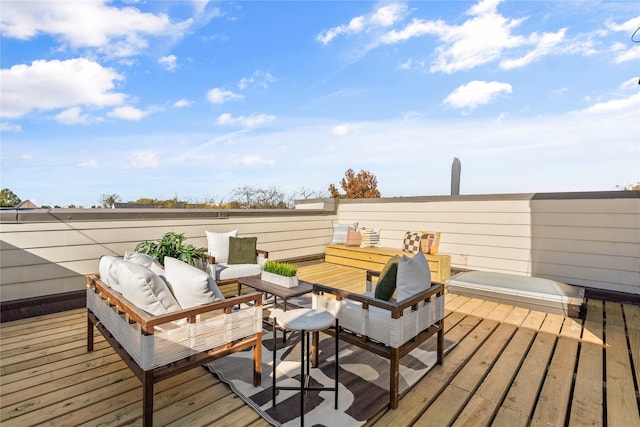 wooden terrace with an outdoor hangout area