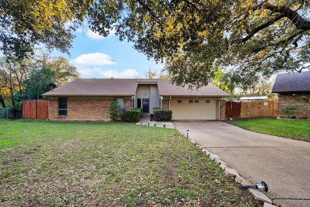 ranch-style home featuring a garage and a front yard