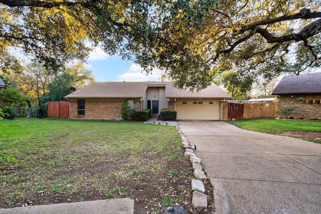 view of front of home with a garage and a front lawn