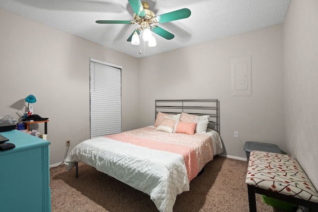 bedroom with electric panel, ceiling fan, a textured ceiling, and dark colored carpet