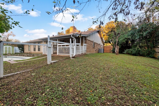 back of house with a yard