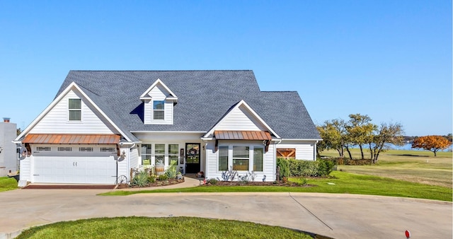 view of front of property featuring a garage and a front yard