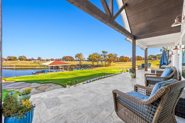 view of patio / terrace with a water view and a gazebo