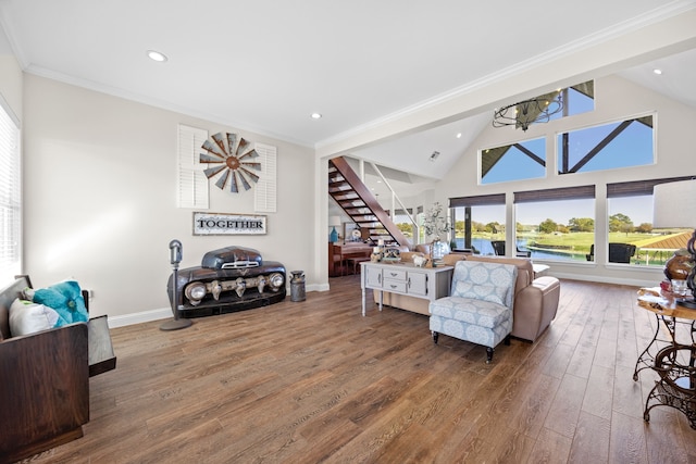 living area featuring baseboards, crown molding, stairway, and hardwood / wood-style floors