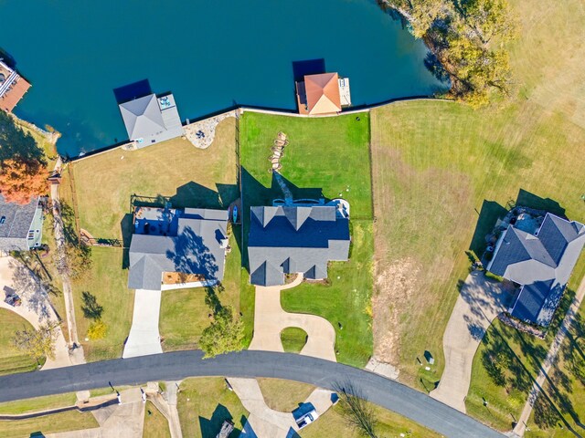 cape cod-style house featuring a front lawn and a garage