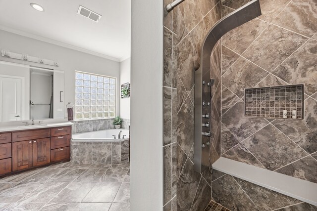 full bath with a garden tub, visible vents, ornamental molding, a tile shower, and vanity