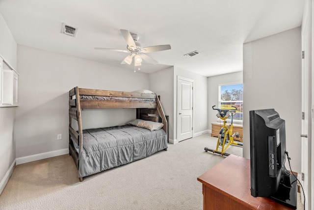 bedroom with carpet floors, baseboards, and visible vents