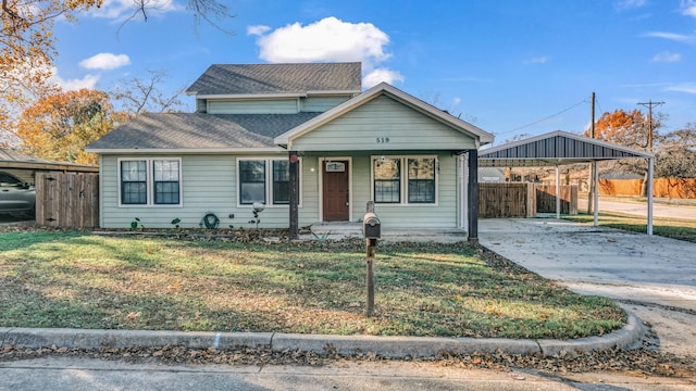 view of front of property with a carport, covered porch, and a front yard