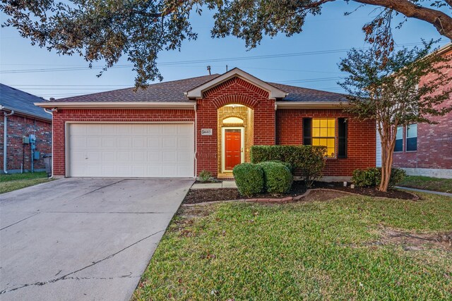 ranch-style home with a front yard and a garage